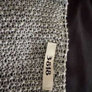 Metallic Silver Open-Knit Top with Numbered Tag